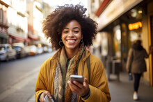 Portrait of beautiful young woman walking in the city holding phone, happy Young woman using smartphone walking through city street