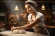 © KWY - A woman kneading bread dough in an apron