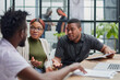 © Katsiaryna - In a modern office. a diverse team of managers at a company meeting to discuss business projects.