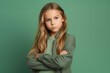 © Markus Schröder - Lifestyle portrait photography of a glad kid female crossing the arms against a pastel green background. With generative AI technology
