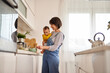 © Stockphotodirectors - Mother and baby boy in the kitchen preparing breakfast