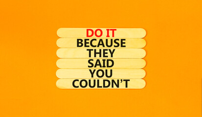Wall Mural - You can do it symbol. Concept words Do it because they said you could not on wooden stick. Beautiful orange table orange background. Business, motivational you can do it concept. Copy space.