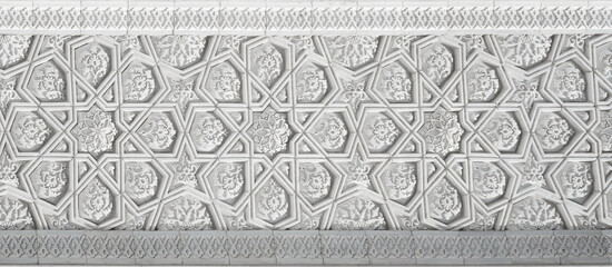 Wall Mural - Geometric traditional Islamic ornament. Fragment of a carved mosaic on white marble.