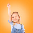 Hand up, portrait and girl child in studio happy, excited and celebrating success on orange background space. Face, smile and kid winner with victory fist for good news, promotion or prize giveaway