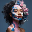 Professional fashion photo of beautiful young people with oil paints on face