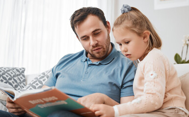 Canvas Print - Bonding, reading and father and child with a book on the sofa for learning or knowledge. Relax, family and a man, dad or girl kid with a story for education or teaching together in a home living room