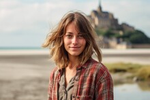 Environmental Portrait Photography Of A Blissful Girl In Her 30s Wearing A Comfy Flannel Shirt At The Mont Saint-michel In Normandy France. With Generative AI Technology