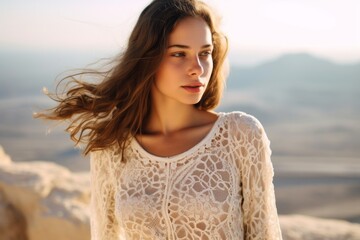 Poster - Environmental portrait photography of a blissful girl in her 20s wearing an intricate lace top at the masada in southern district israel. With generative AI technology