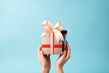 Wall Mural - a woman holds a gift box with cosmetics on a blue background