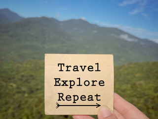 Wall Mural - Motivational and inspirational wording. Travel, Explore, Repeat written on a notepad. With blurred styled background.