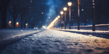 Snowy Winter Road At Night With Street Lamps And Falling Snow.