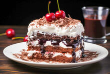 Black Forest Cake Or Schwarzwälder Kirschtorte, A Decadent Chocolate Cake Layered With Whipped Cream And Cherries, Garnished With Chocolate Shavings