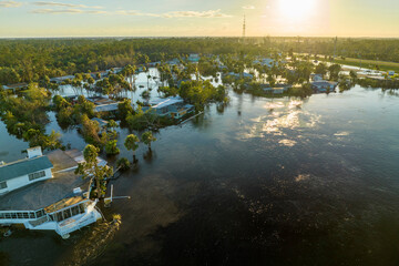 Poster - Consequences of natural disaster. Heavy flood with high water surrounding residential houses after hurricane Ian rainfall in Florida residential area