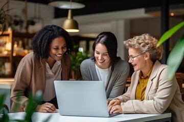 Leinwandbilder - Generative AI : Joy of teamwork. Female coworkers using laptop,