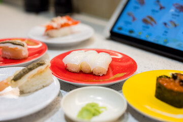 Canvas Print - Different dish of the Japanese sushi in conveyor belt sushi shop