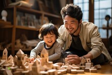 Asian Dad Sit On Floor Play With Small Son. Happy Caring Father Engaged In Activity Game Build With Blocks Bricks.