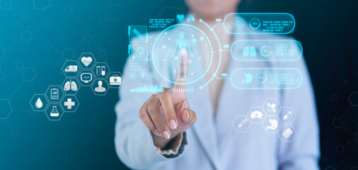 Medical technology and futuristic concept. Doctor and modern virtual screen interface icons. Doctor's hand pokes at a medical icon harogram. Health Insurance, telemedicine, virtual hospital concept