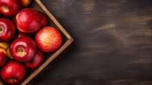 In A Wooden Box Are Ripe Red Apples. Top View With Space For Text