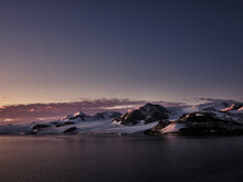 Scenic View Snowy Majestic Mountain At Dusk, Antarctic Peninsula, Weddell Sea, Antarctica
