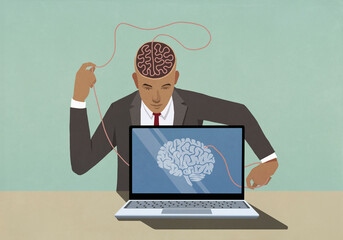 Businessman at laptop pulling at string in brain
