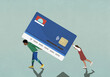 © fStop - Couple carrying and pushing large, heavy credit card debt burden