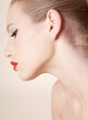 © fStop - Close up profile of beautiful young woman with red lipstick