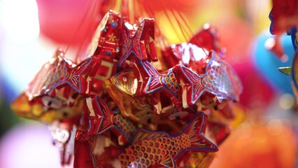 Wall Mural - Decorated colorful lanterns hanging on a stand in the streets in Ho Chi Minh City, Vietnam during Mid Autumn Festival.