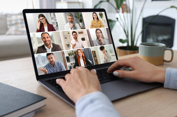 Sticker - Woman participating in webinar via laptop at table, closeup