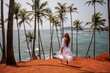 Woman in a white dress on a paradise island