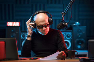 Wall Mural - Professional radio host working in the studio