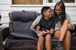 © Austockphoto - Aboriginal girl and young Aboriginal boy sitting together