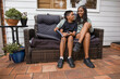 © Austockphoto - Aboriginal girl and young Aboriginal boy sitting together - motion blur on girl