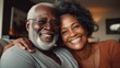 © visoot - Portrait of happy black elderly senior couple at home.