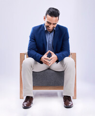 Sticker - Smile, professional and businessman on a chair in a studio with confidence, confidence and law career. Happy, advisor and young male attorney from Mexico sitting on sofa to relax by white background.