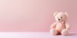 Cute teddy bear isolated on soft pastel background, with copy space for ads and text