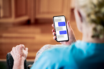 Text or chat messages in phone. Elder senior mature woman sms texting with friend or family. Old lady with cellphone messaging app. Online communication technology. Pensioner using smartphone.