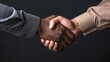© Vladyslav - Handshake black and white hand. No racism caucasian human. Interracial concept on the black background isolated