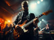 © Falk - A rock band is performing on stage. Guitarist, bass guitar and drums. The guitarist is in the foreground. Close up
