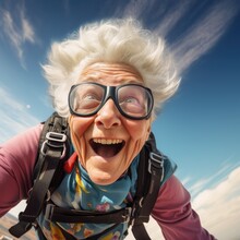 Funny And Smiling Elderly Woman Has Fun Skydiving. 