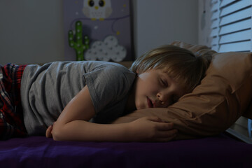 Wall Mural - Little boy snoring while sleeping in bed at night