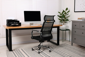 Canvas Print - Stylish room interior with desk, modern printer and computer