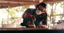 Construction, Carpenter And Handyman With Wood Project In Workshop At Home For Renovation And Maintenance. Contractor, Machine An Person With Ppe And Bokeh In Workplace At House For For Carpentry
