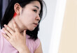 © doucefleur - Asian woman suffering from lymphadenitis, lymph node inflammation and feeling pain , swollen behide the ear