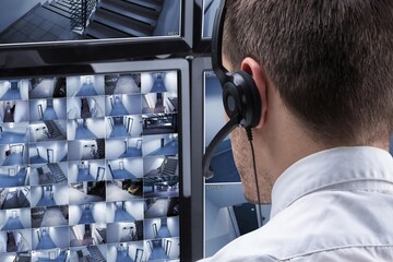 Aufkleber - Operator Looking At Multiple Camera Footage On Computer