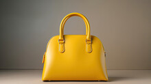 Women Leather Yellow Handbag On Gray Background.