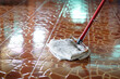 © Sanhanat - Close up man use a mop by using old towel to mop the floor. Concept, household chore in daily life. Hygienic and sanitary. Mop the dust, wipe the floor. Cleaning house. Maintaining tile floors.