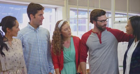 Poster - Animation of graphs moving over multiracial happy colleagues standing and talking in office