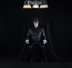 Wall Mural - portrait of a man in a monster mask on a black background