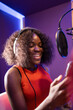 © ADDICTIVE STOCK - Black woman singing and creating song