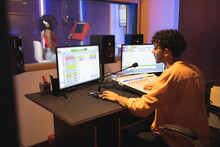 Man Recording Vocal In Studio